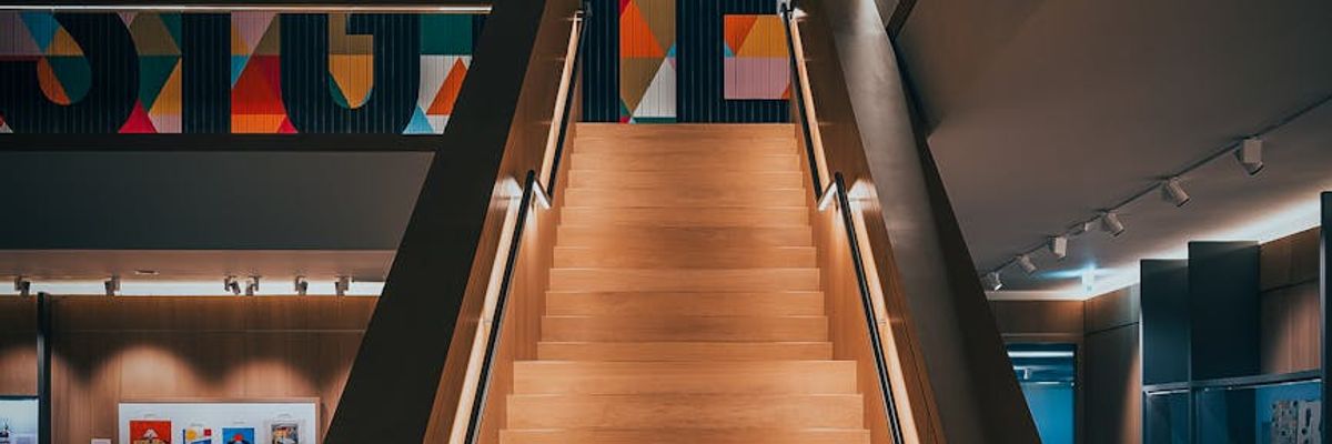 Wide futuristic landscape with soft neon light representing universality